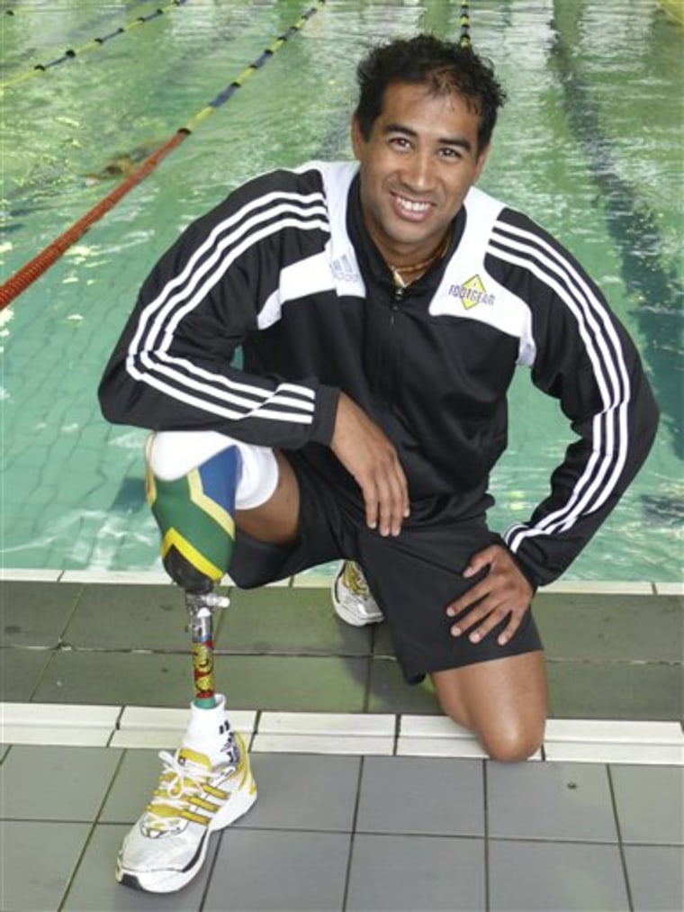 In this May 14, 2009 photo provided by Pew Environment Group, former lifeguard Achmat Hassiem, 29, of Cape Town, South Africa, poses for a photo. Hassiem lost his foot when a shark attacked him during rescue practice in 2006 and said he now believes certain things happen for a reason. (AP Photo/Pew Environment Group) NO SALES